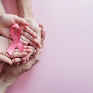 hands holding pink ribbons, Breast cancer awareness and October hands holding pink ribbons, Breast cancer awareness and October Pink day